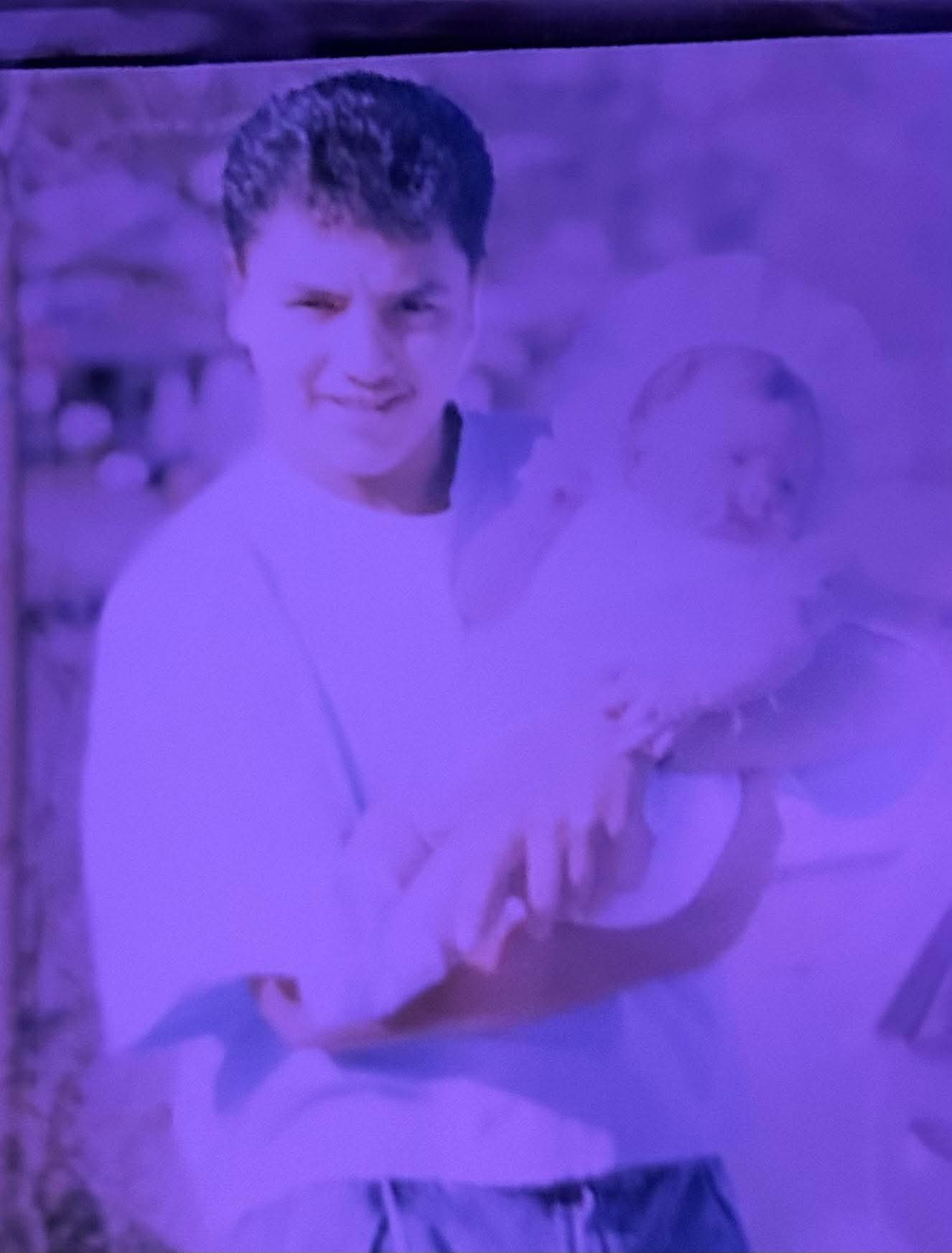 Damaged photo — before